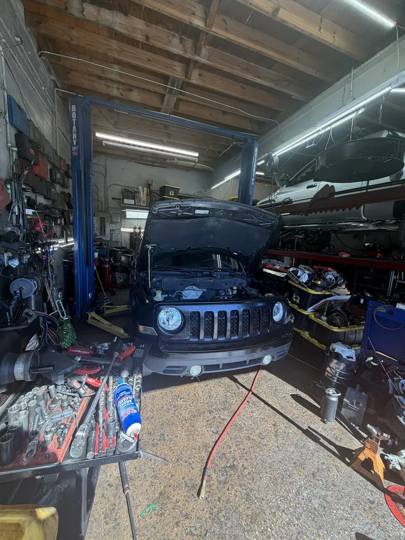 Jeep on the shop floor surrounded by tools